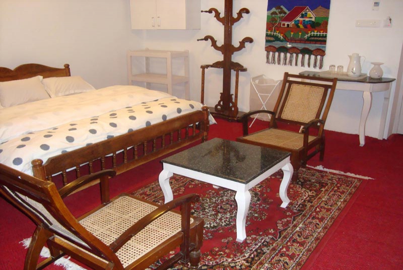 Bedroom with a sitting table at Mount Pleasant
