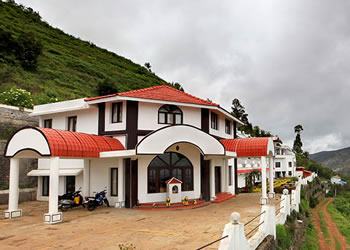 Exterior view of United-21 Resorts nestled amidst majestic mountains