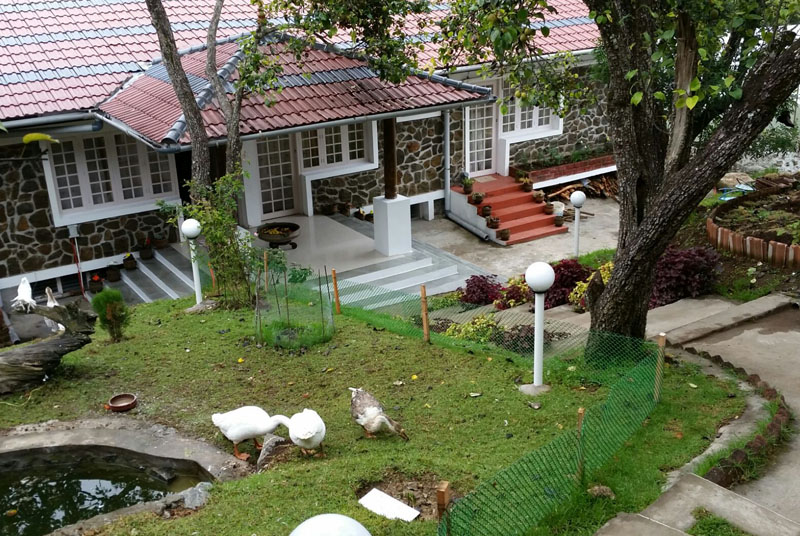 Exterior view with garden at Mount Pleasant Resort